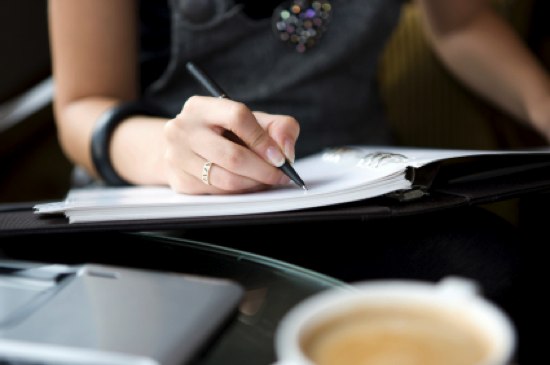 business woman writing